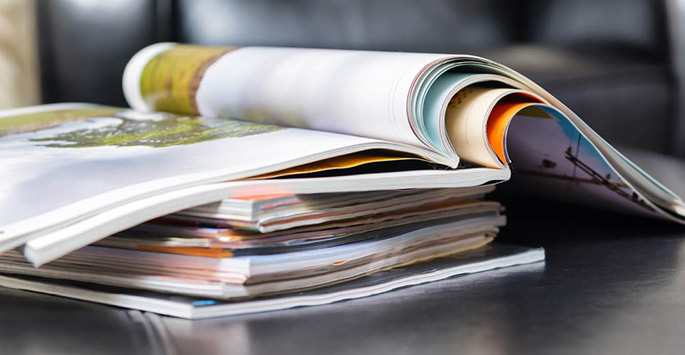 A pile of publications on a table