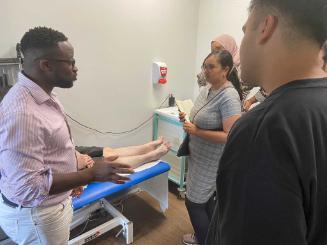 Tutor giving feedback after clinical examination at NeuroPACES course