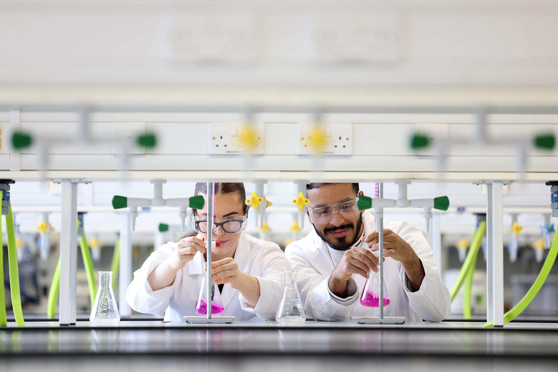 two students conducting an experiment at a lab at the university of Liverpool