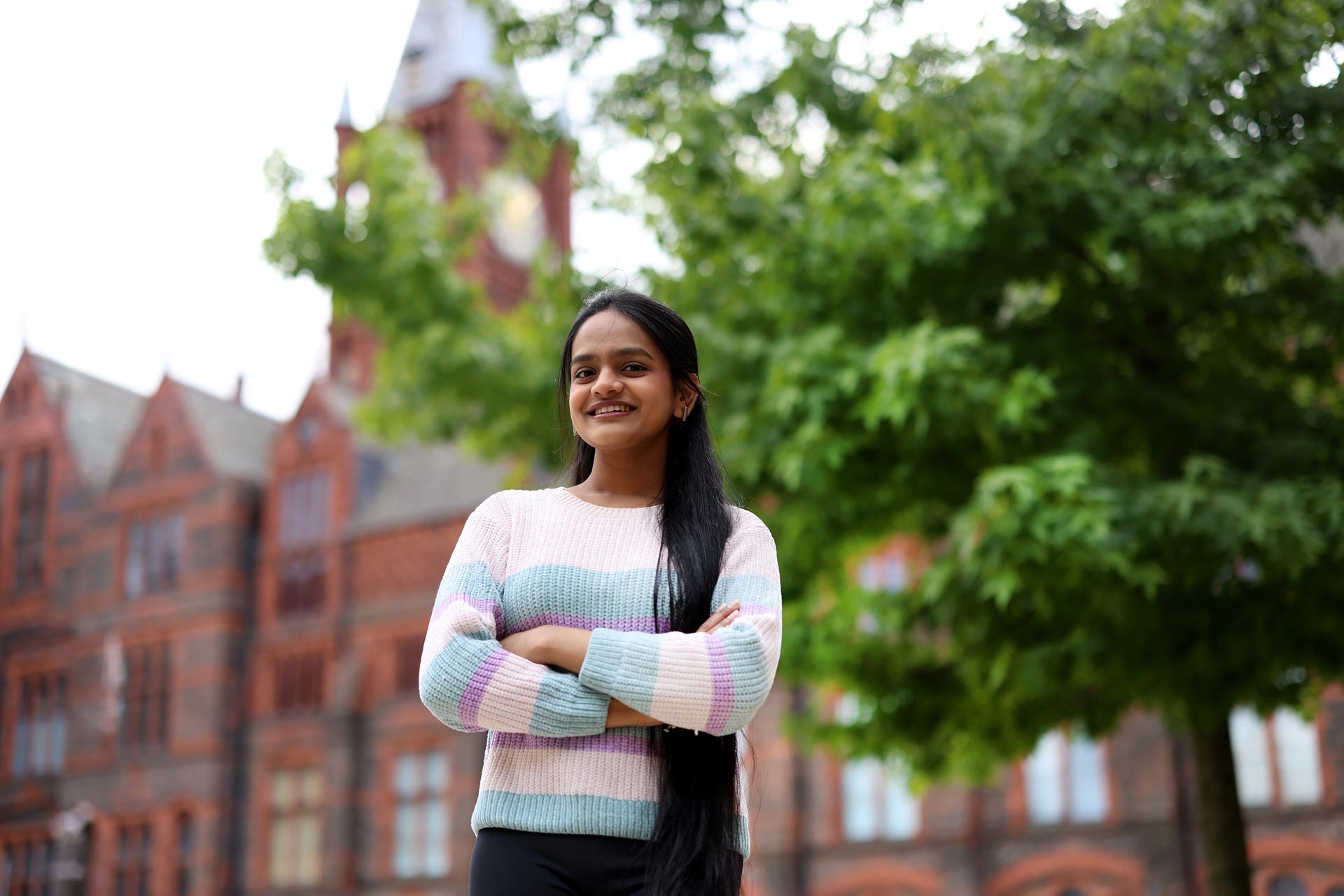 International student, Aparna Wakle, standing in The Quadrangle.