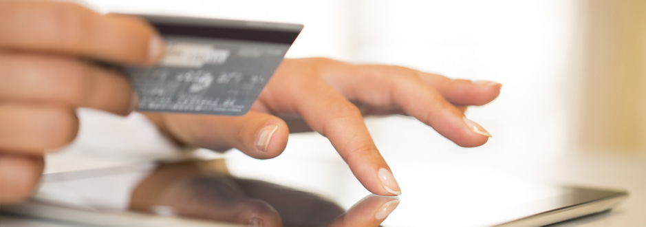 Woman paying online with a credit card