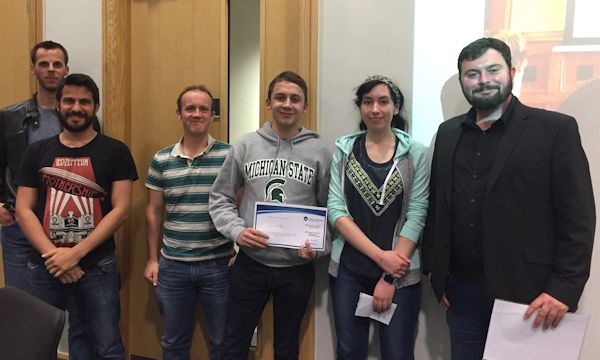 Winner of Best 1st year PhD student talk, Ryan Llewellyn (Centre), with the School Tutors