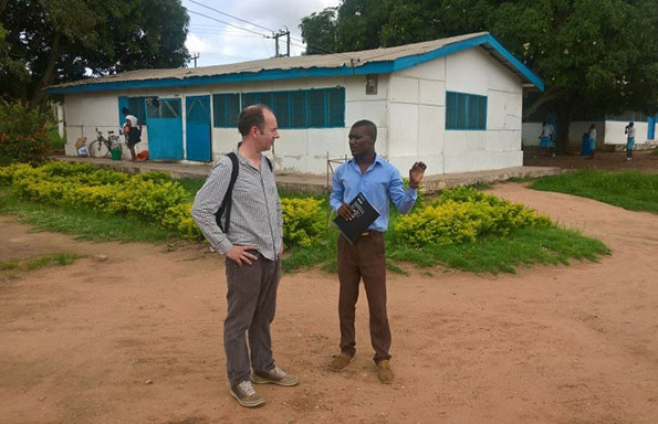 Two men talking in Ghana