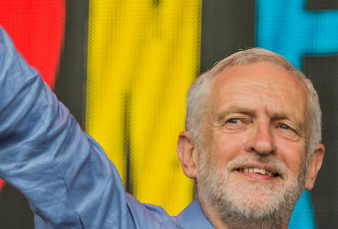 Jeremy Corbyn smiling and waving