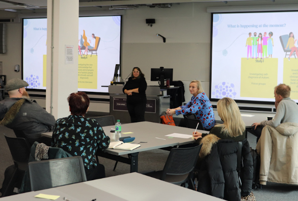 Discussions with attendees at the Autism Hub during a presentation