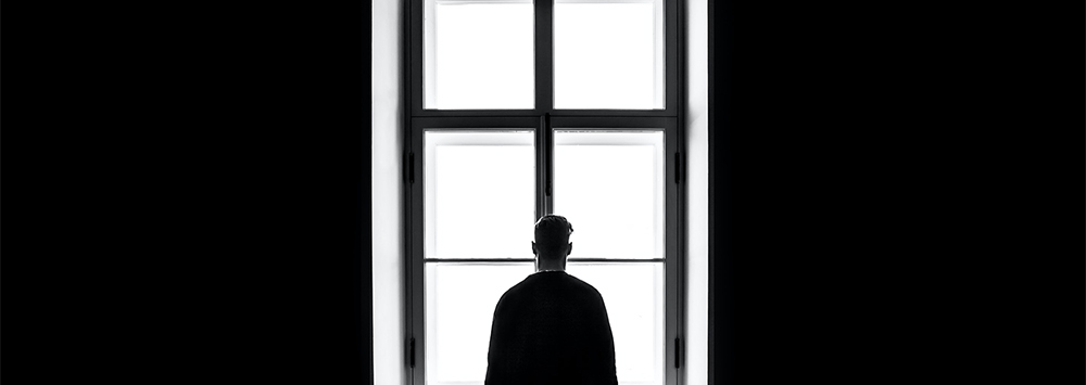 Person looking out of a window