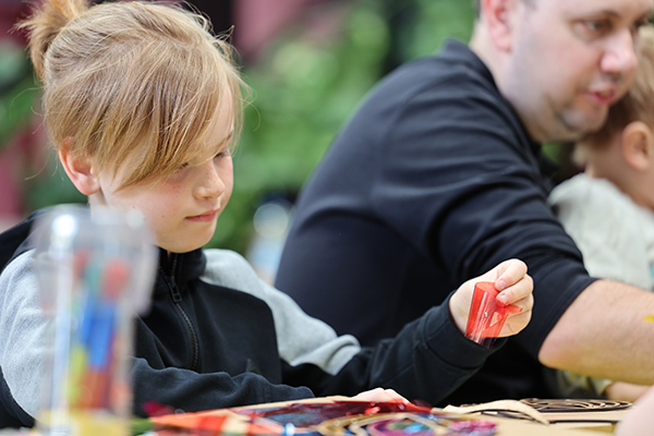 A child doing arts and crafts.