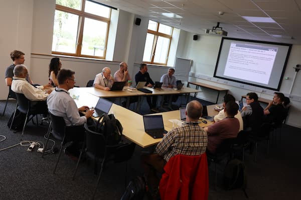 A group of people in a meeting room.