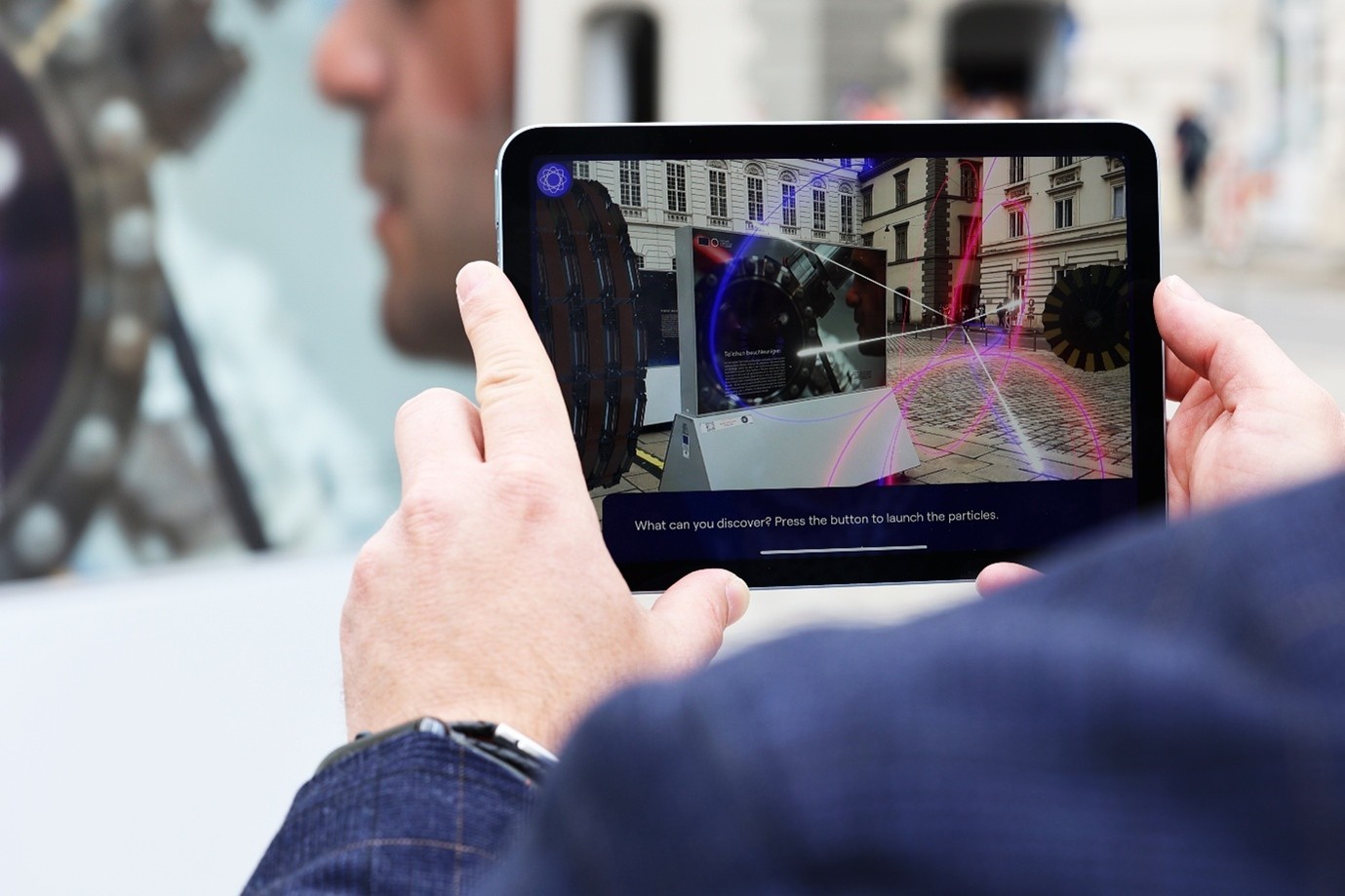 A person holding an iPAD.