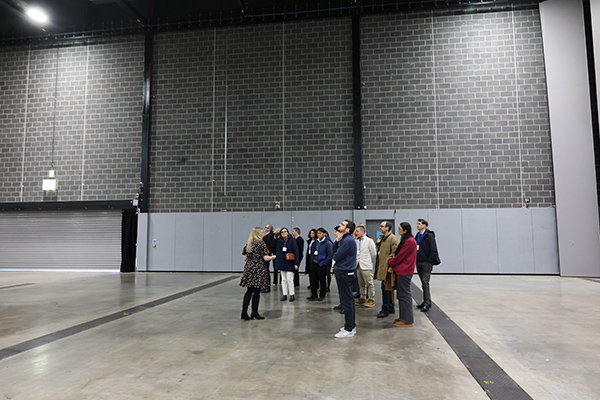A group of people in a large hall.