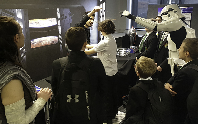 Feeling the electrostatic force around a Van de Graaff generator.