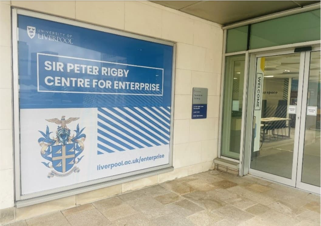 An exterior view of the Sir Peter Rigby Centre for Enterprise, including the door and the sign for the centre in the window.