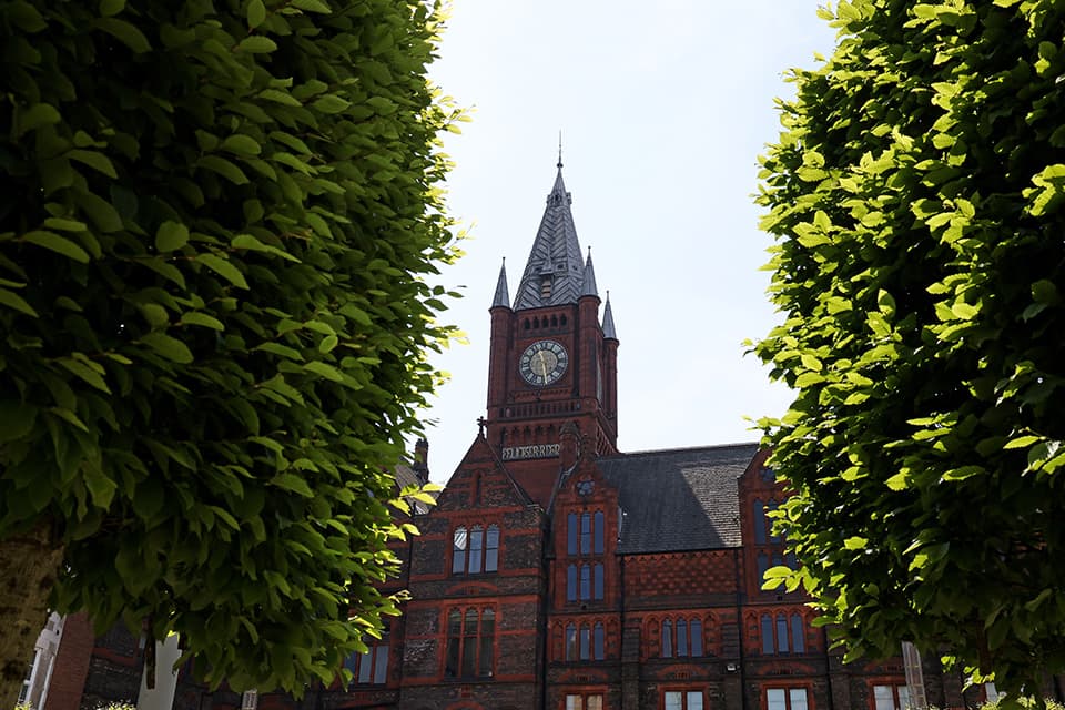 Victoria Building amongst green leaved trees