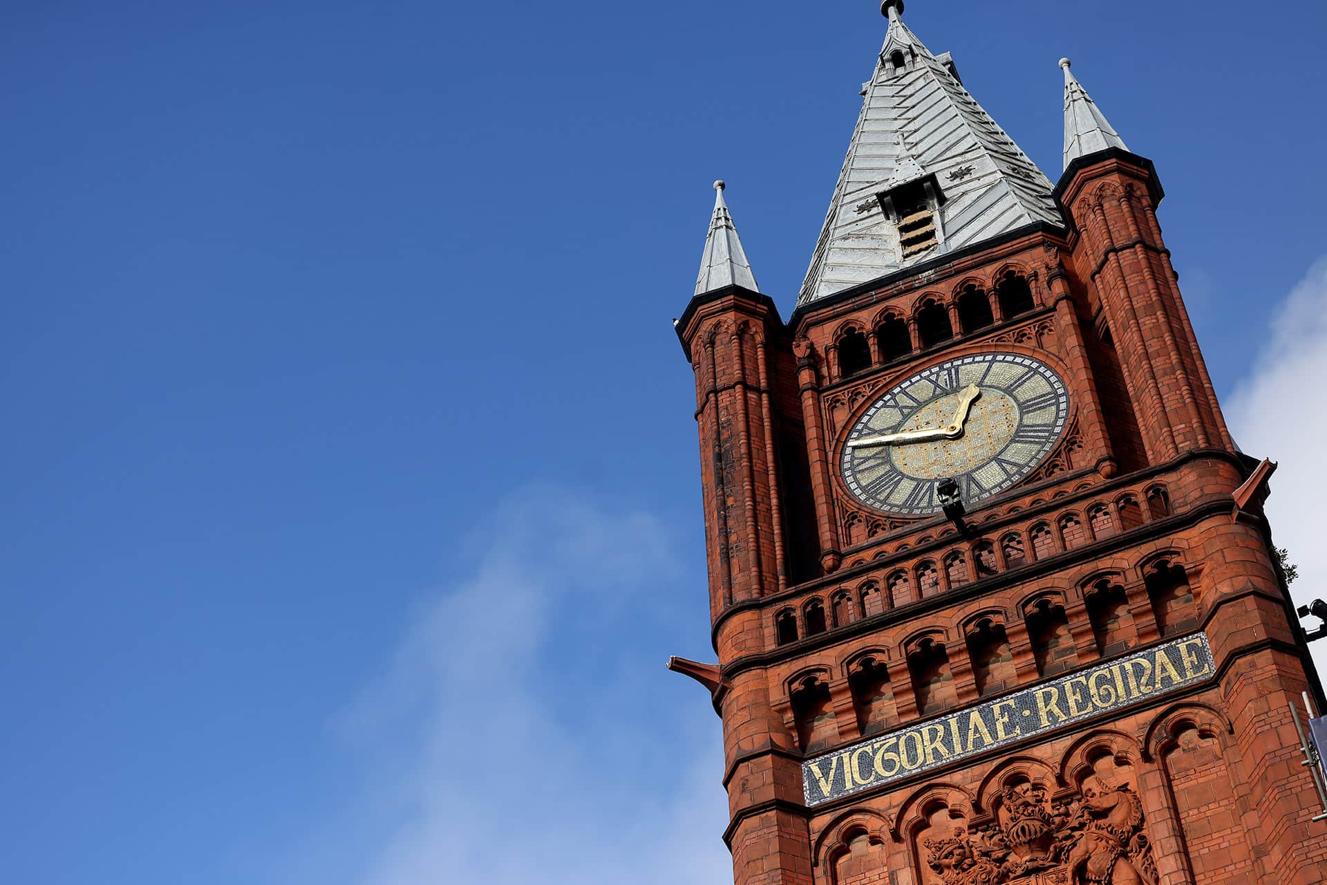 Victoria Building clock tower against a blue sky