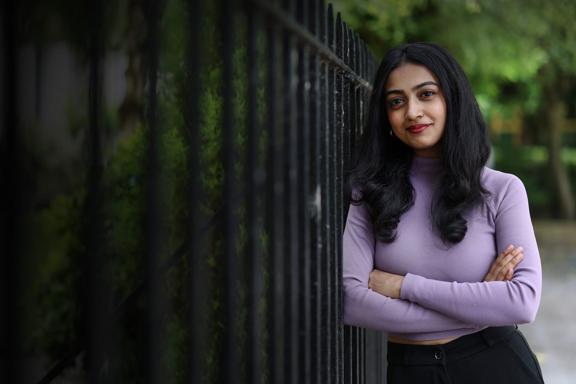 Student standing against the railings of Abercromby Square