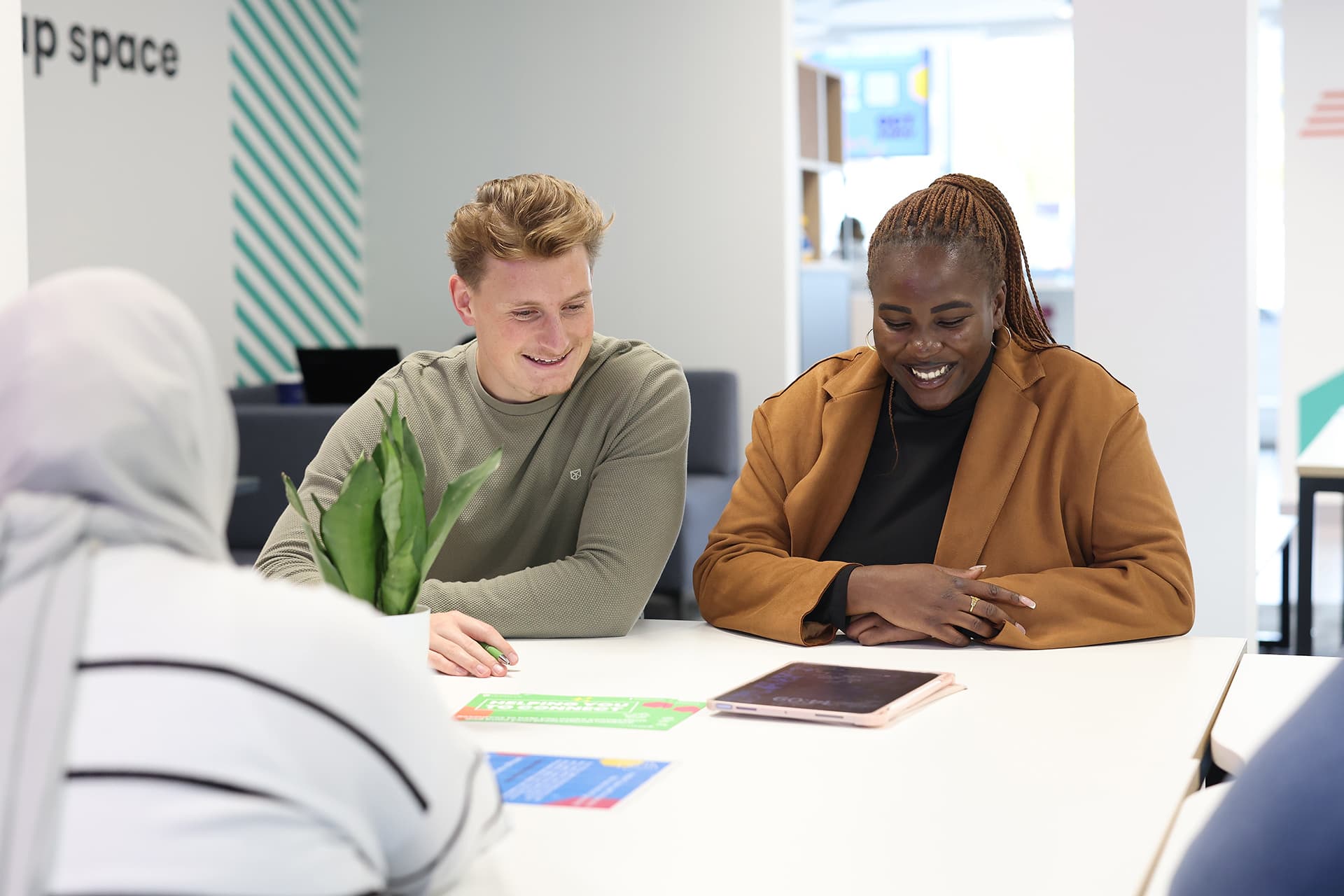 Students sitting at a table working together