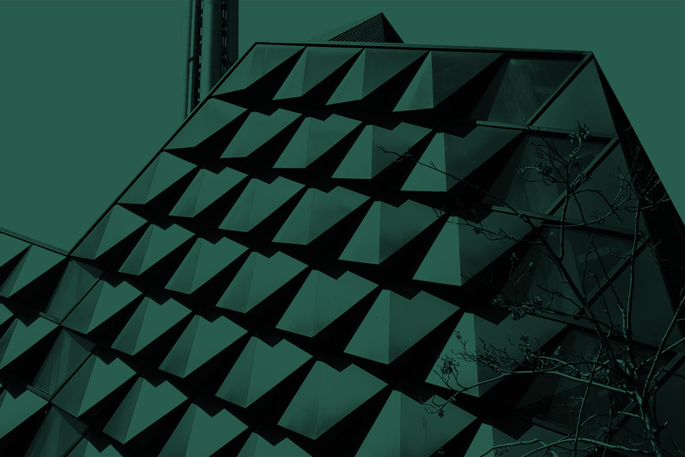 Dark green tinted image of the energy centre on campus