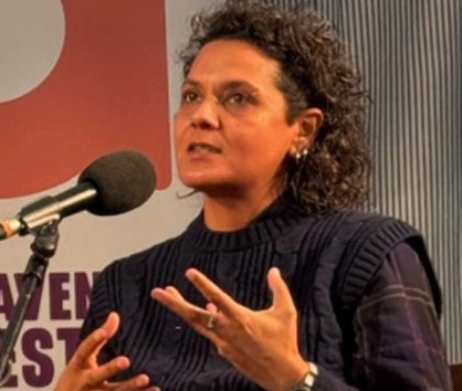 Ceren standing talking into a microphone