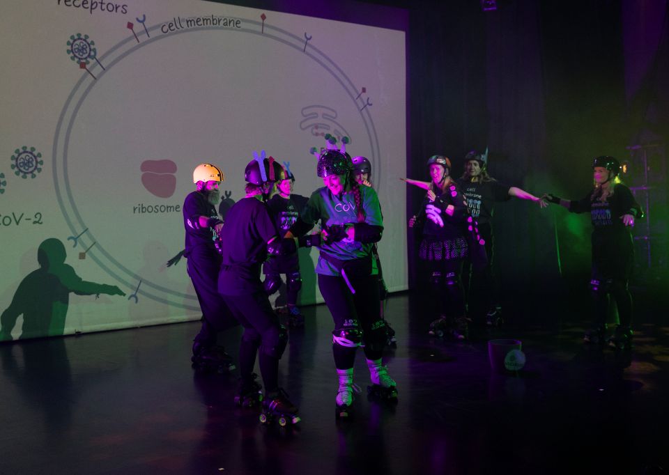 People roller skating indoors