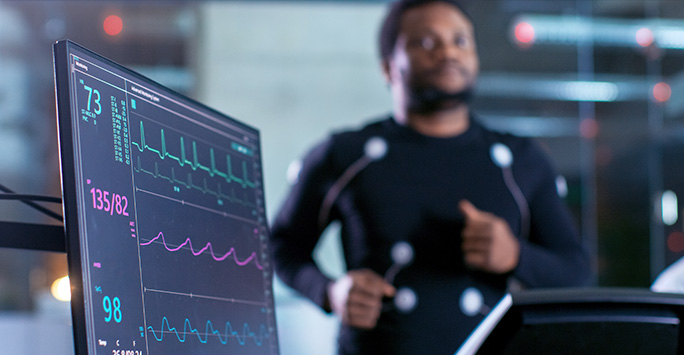 Man on treadmill connected to EKG