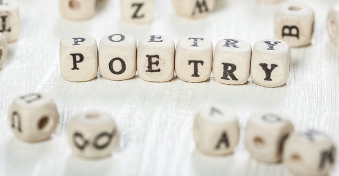 Scrabble style dice with POETRY formed