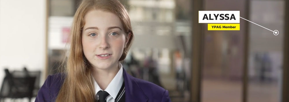 A head and shoulders shot of a young girl in school uniform, with the words 'Alyssa, YPAG Member' written on it
