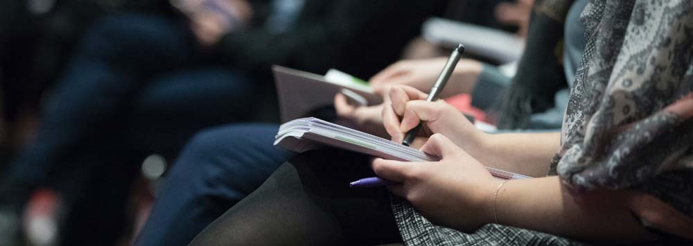 Woman taking notes 