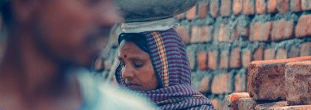 A woman carrying a load