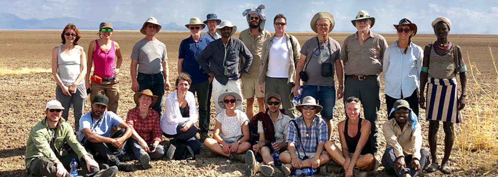 Group standing in desert