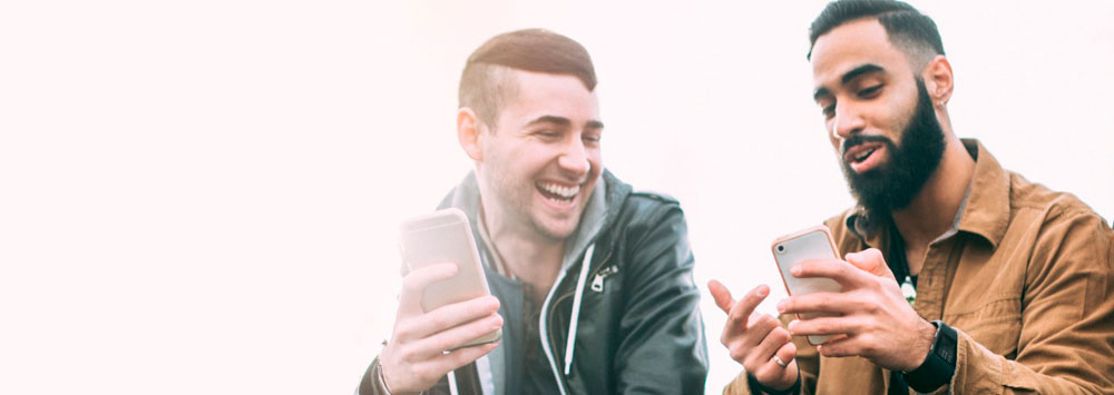 Two men looking at a phone