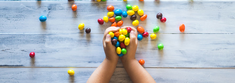 Child's hands full of sweets