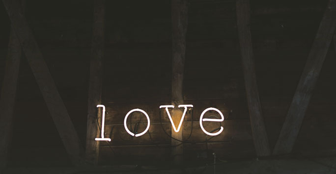 Neon sign spelling 'love'