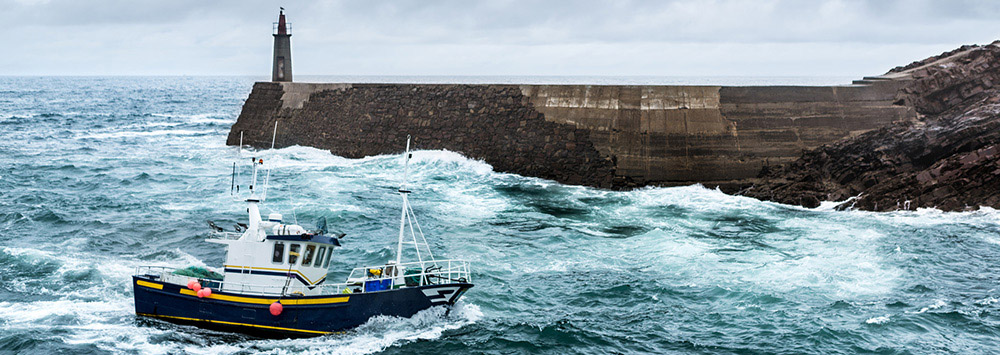Fishing boat on rough waters