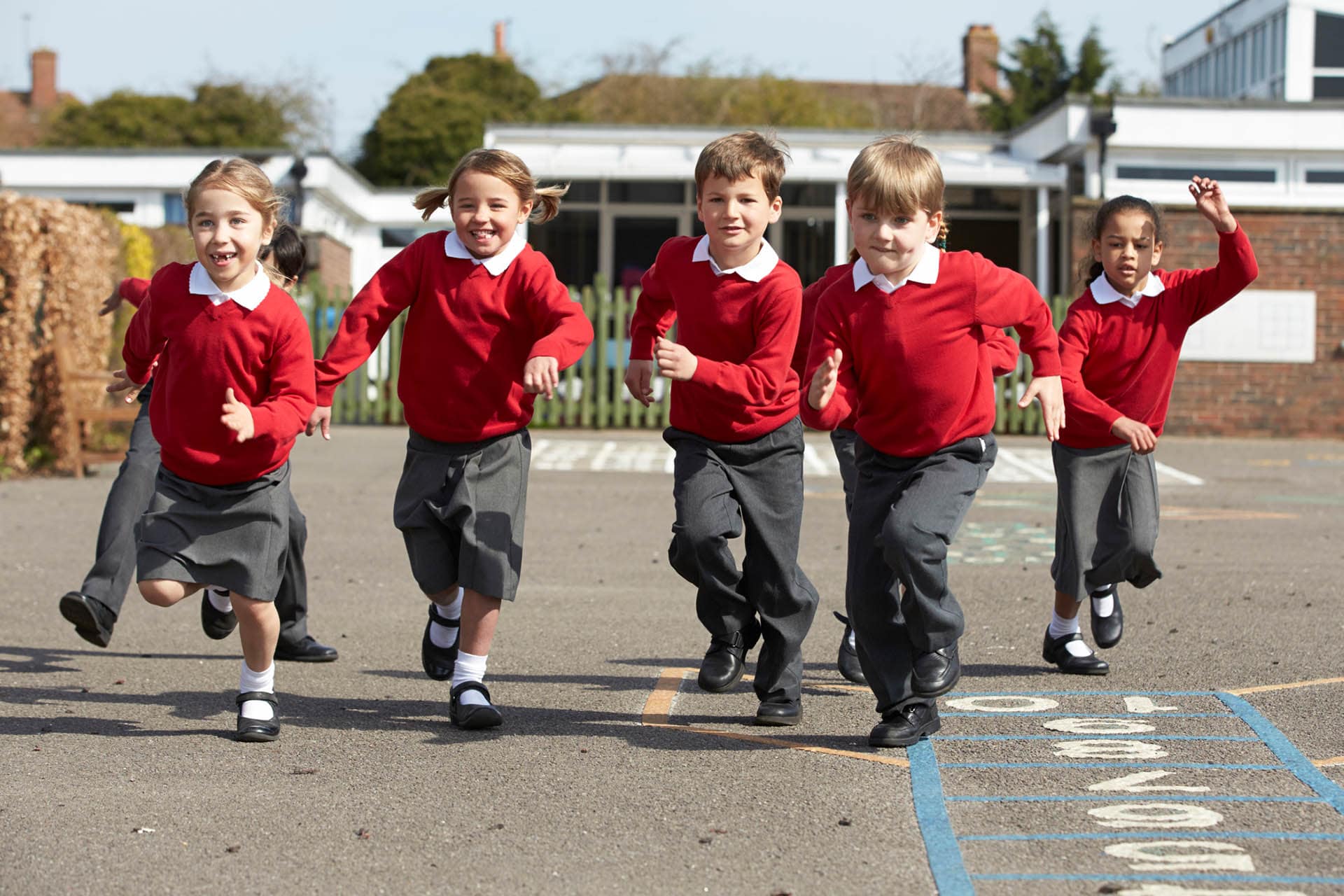 Children running in school playground