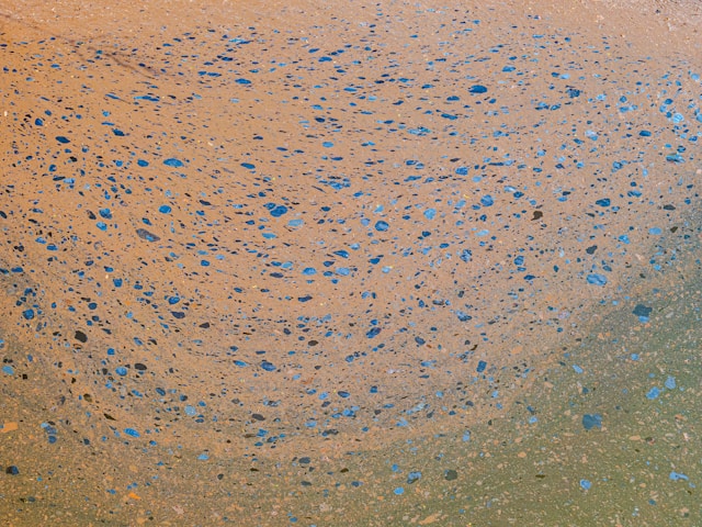 Abstract pattern of a biofilm on a lake during summer