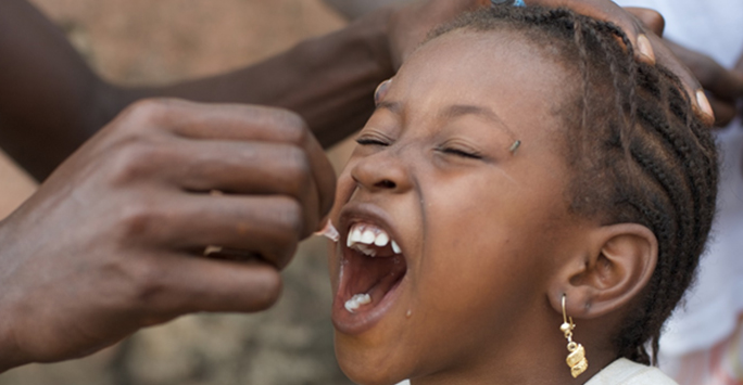 Young girl receiving rotavirus vaccination