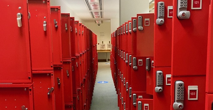 A locker room with arrows on the floor