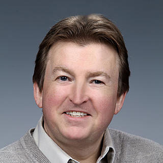 Headshot photograph of Nigel Browning