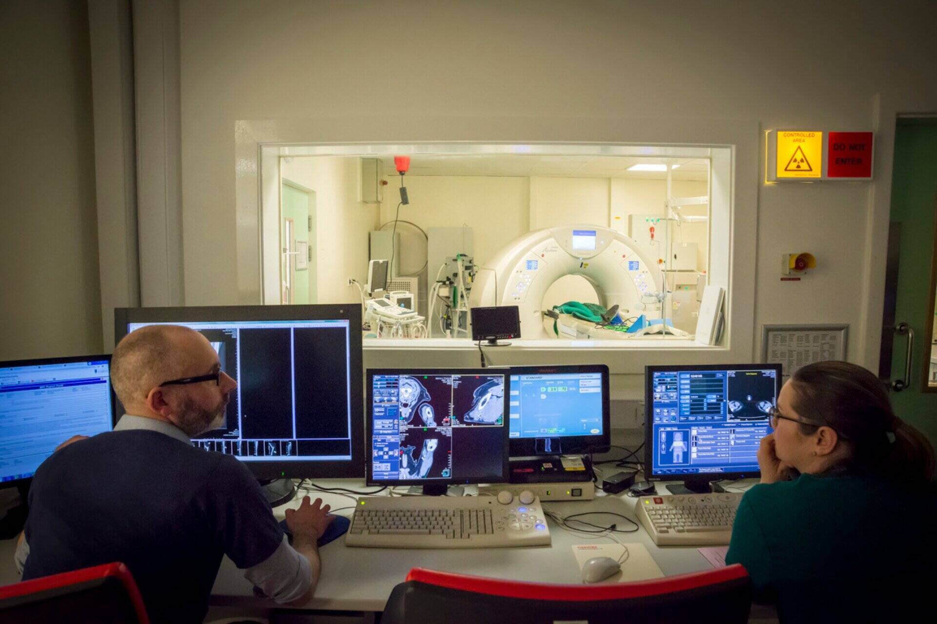A veterinary lab with screens and a scanner