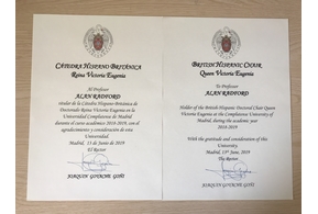 Photograph of two certificates from Complutense University of Madrid. One in English and one in Spanish
