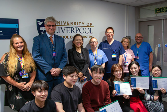 Members of University staff with the visiting staff and students