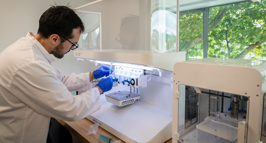 Researcher conducting an experiment in a biomedical engineering lab