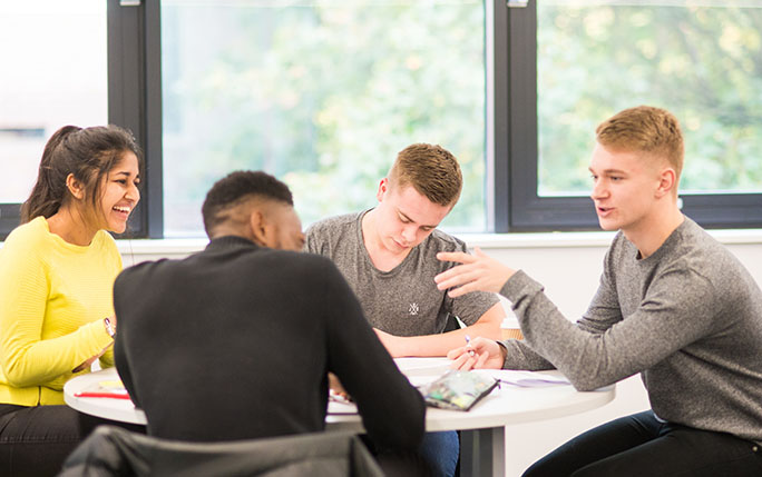 Group of students working together at a table