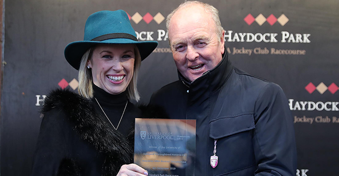 Fiona Dowling presenting a trophy to Jonjo O'Neill at Haydock (Image: John Grossick)