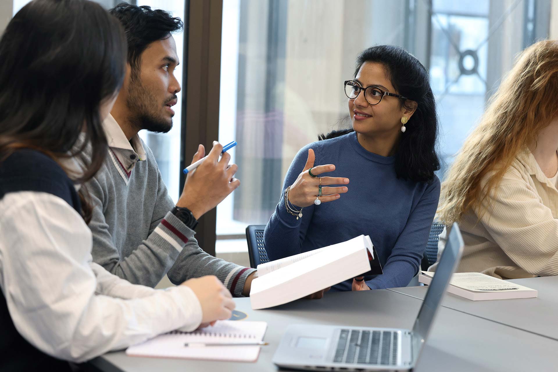 PhD students talking to each other