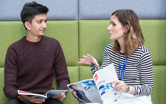Careers adviser talking to a master's student