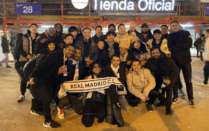 Group of MBA students standing outside of Santiago Bernabéu Stadium.