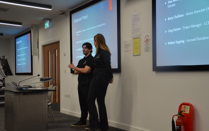 Two guest speakers presenting to undergraduate students as part of employability event