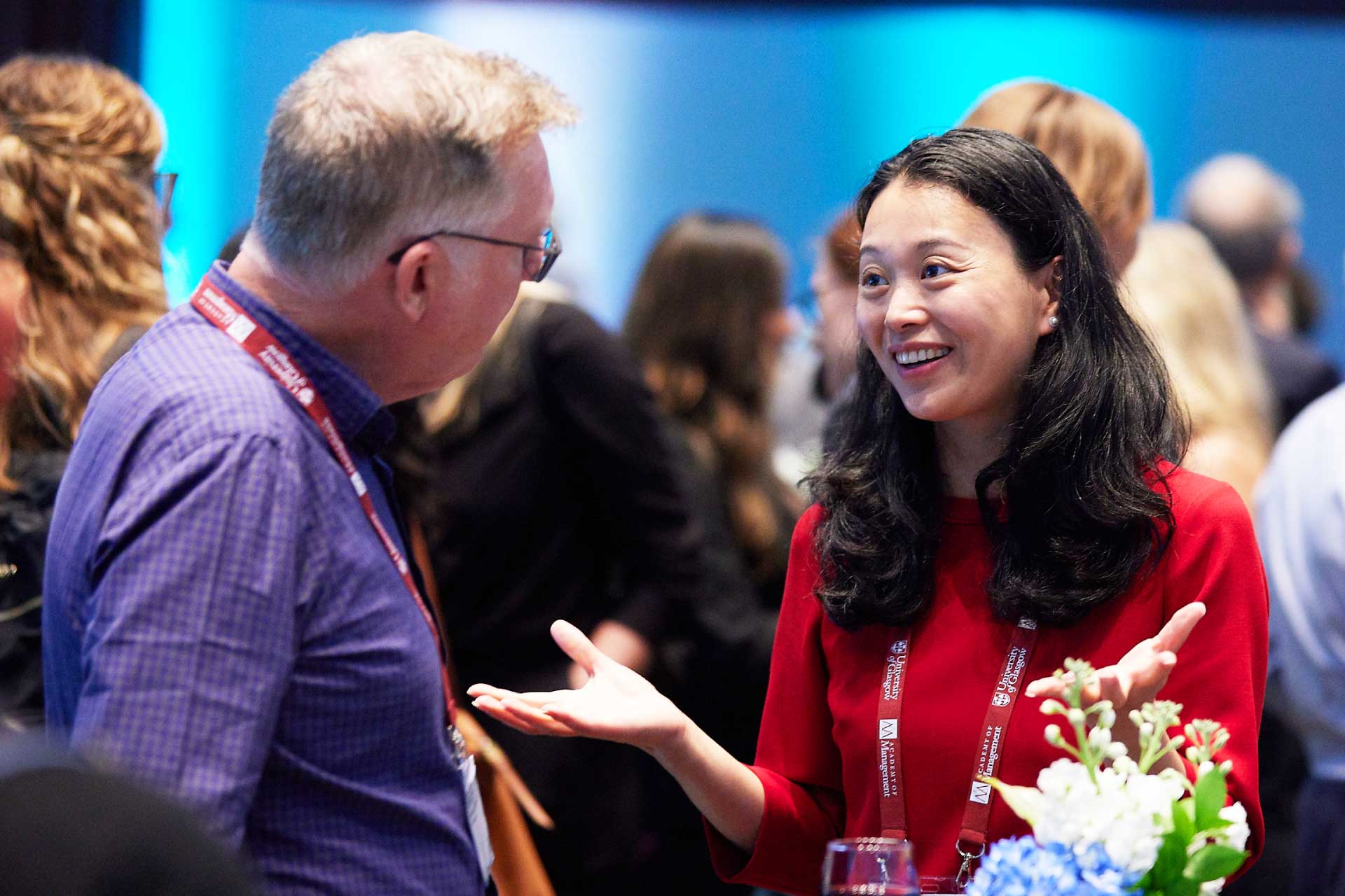 Male and female academics having a chat at the AOM 23 University of Liverpool reception.