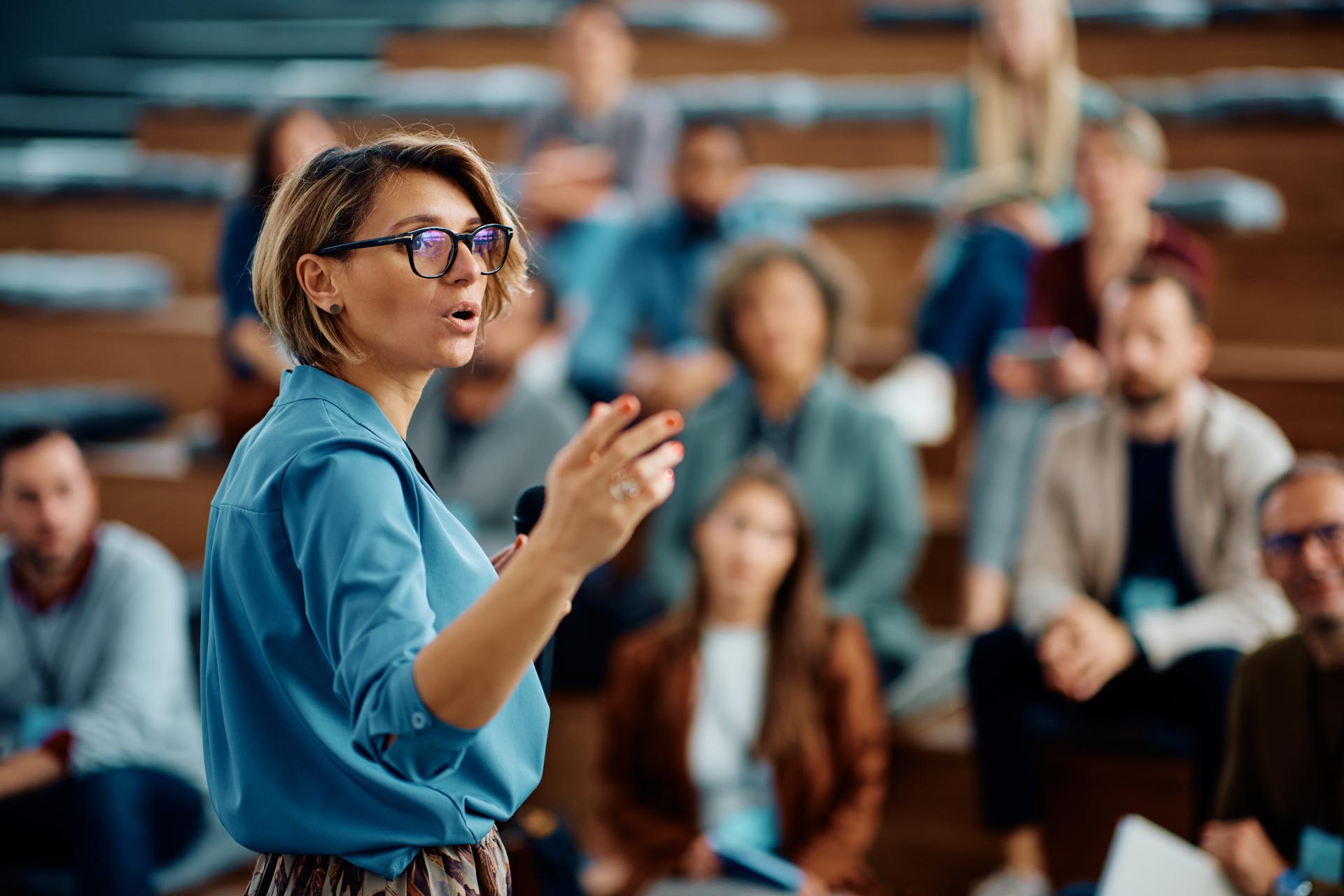 Female academic speaks during a presentation.